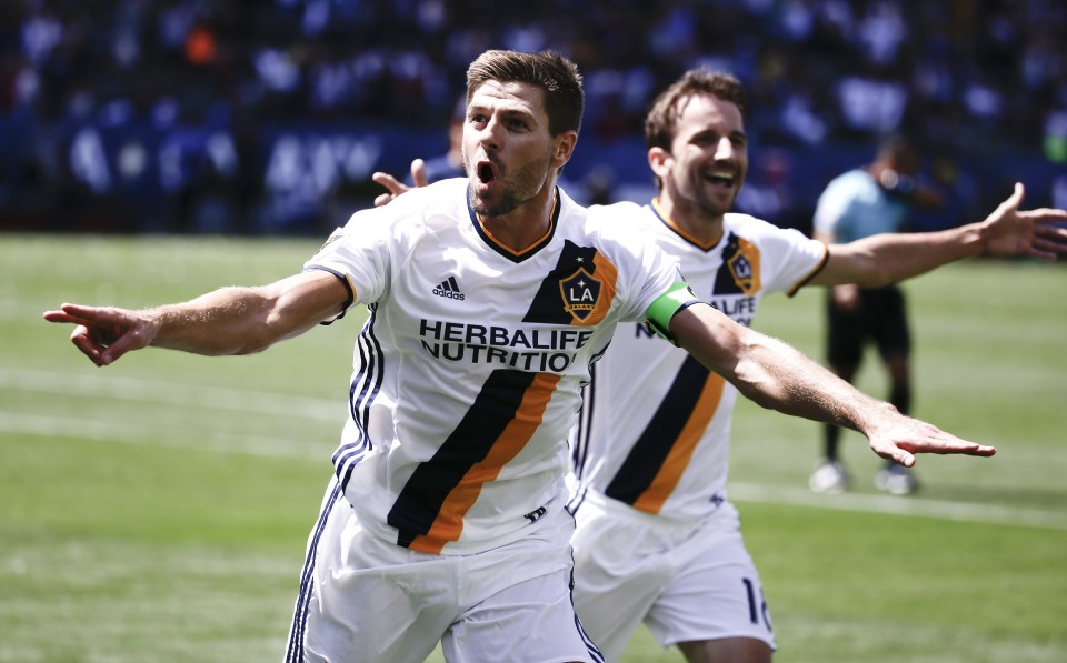 Ex-Liverpool star Steven Gerrard celebrates a goal for LA Galaxy with Mike Magee