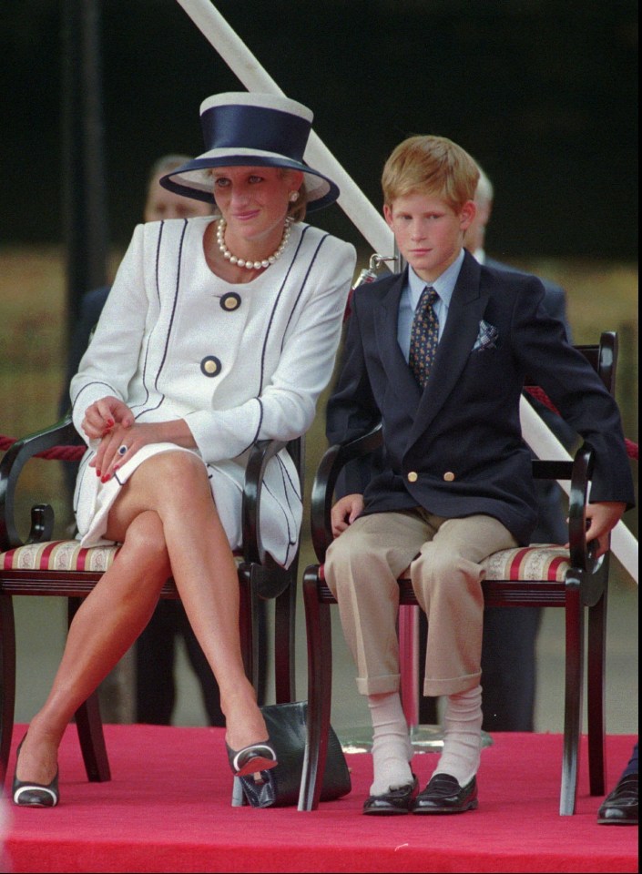 Princess Diana, left, sits next to her younger son Prince Harry during V-J Day celebrations in London in 1995