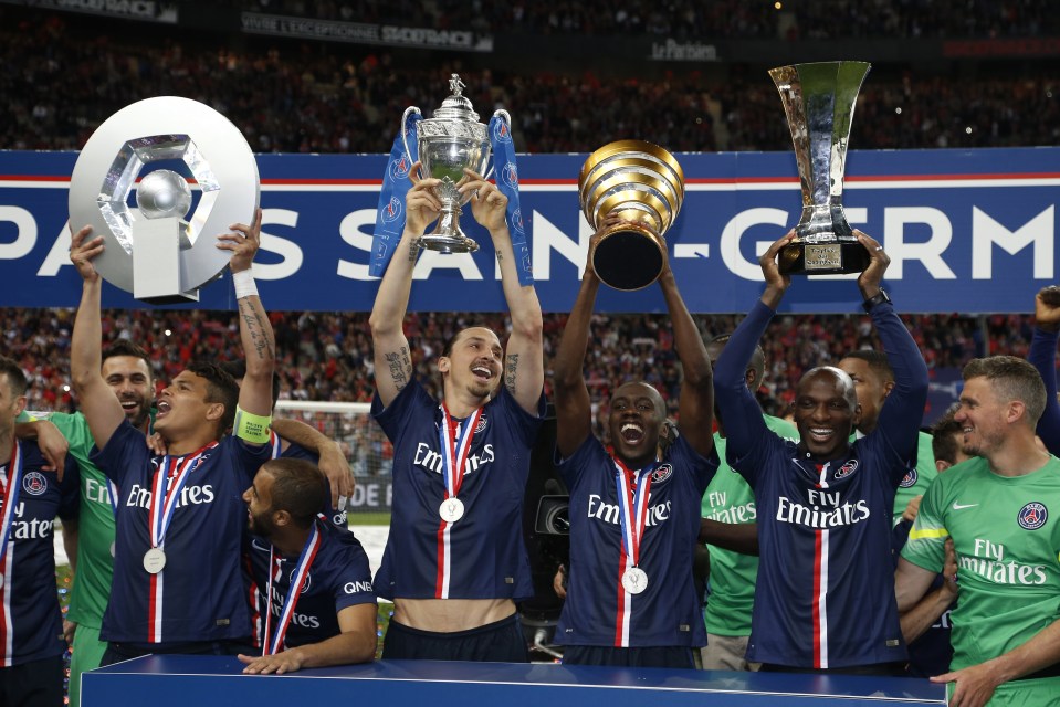  Paris Saint-Germain lift up trophies in front of fans