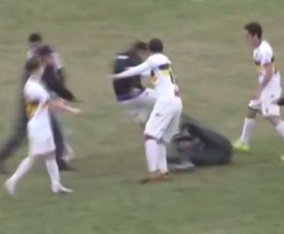  A Tiro player shockingly kicks a fan in the face as the players fight back