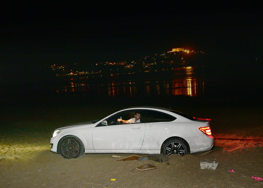  Dopey Aaron got stuck in the sand because he mistook the beach for a car park