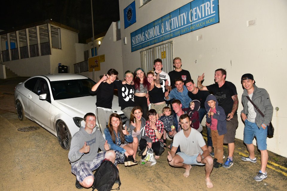  The group had to work quickly to push the car out of the beach