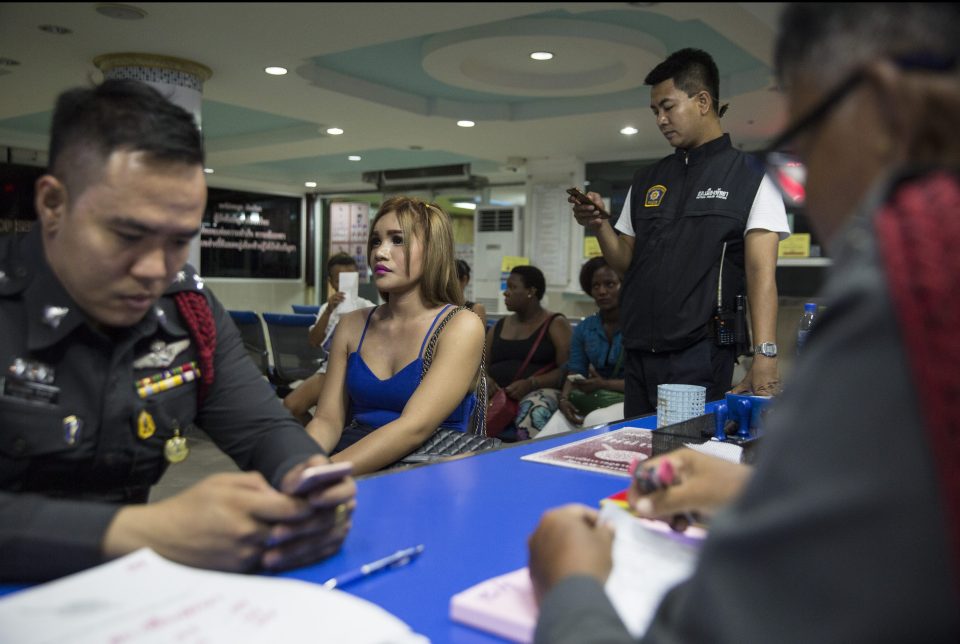  A vice girl sits inside a police station after being arrested