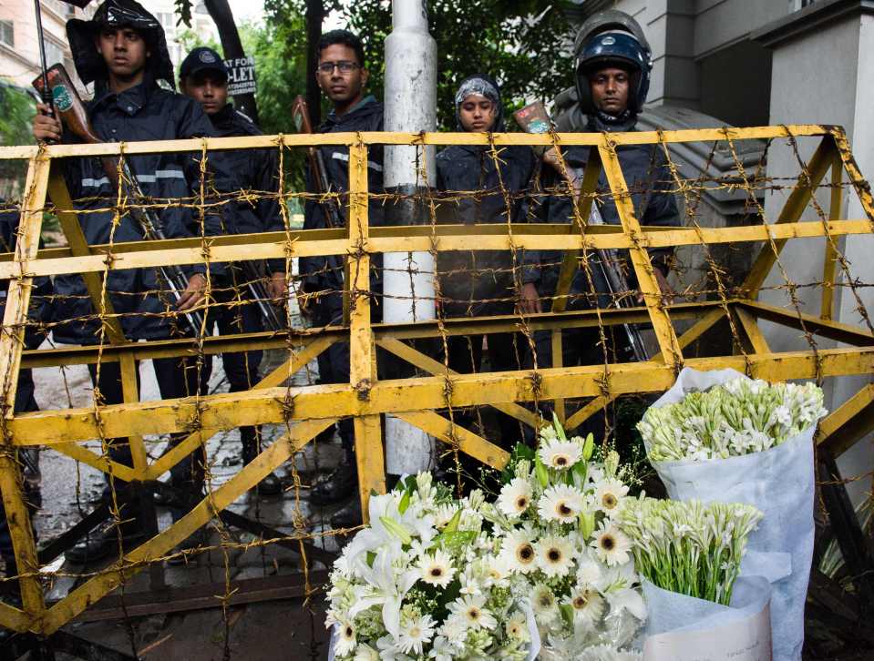  Tributes ... A police checkpoint was surrounded by flowers left by well-wishers after the Dhaka bloodbath