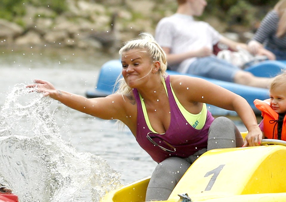 The mum-of-five splashed her two older children who were riding in their own pedalo