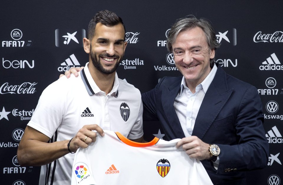  Valencia director Jesus Garcia Pitarch posing with one of the club's summer signings Martin Montoya