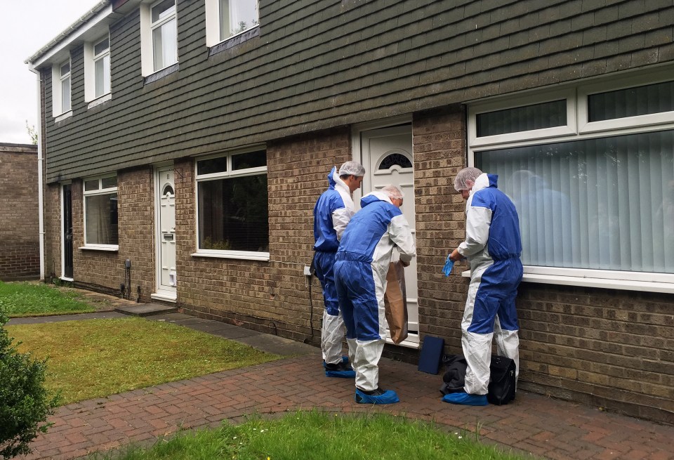  Forensic officers prepare to enter a property in Velville Court - where a baby boy was taken to hospital from