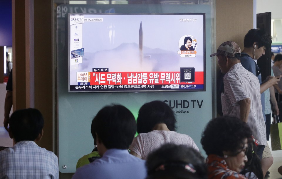  Fear ... South Korean TV covered news of the missile launch on Wednesday