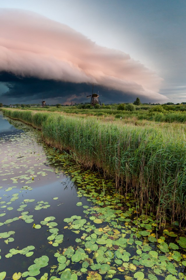  Imposing ... Clouds slowly make their way over windmills in Kinderdijk, Netherlands