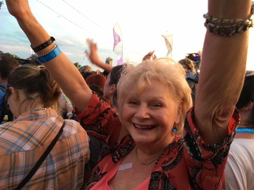  Janice has always loved music, she's seen here at a Take That gig