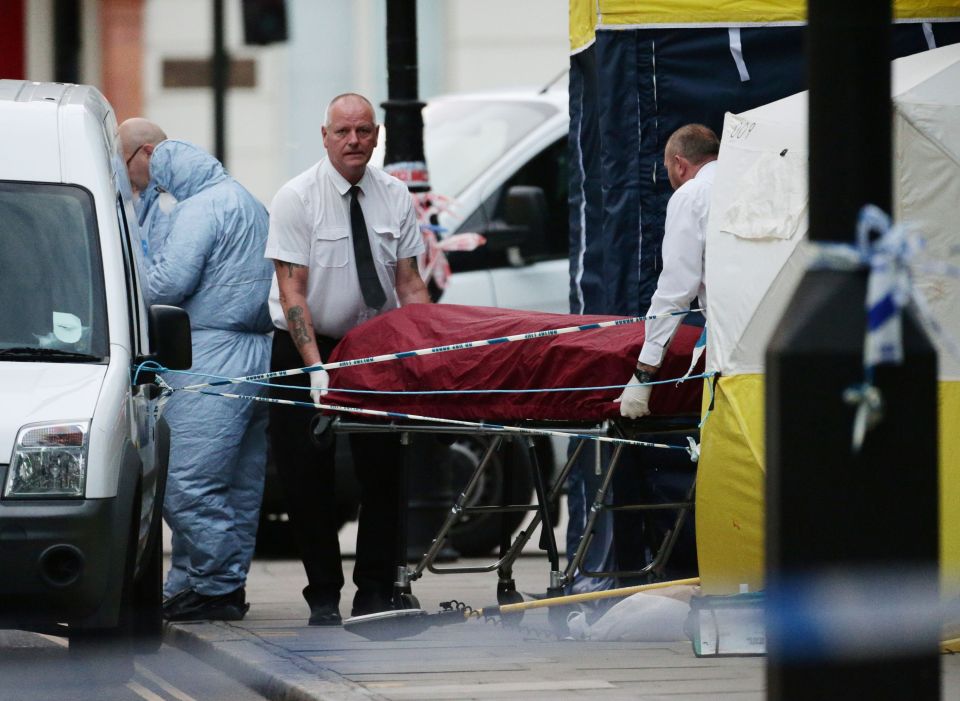  Tragic end ... Darlene's body is removed from the scene in Russell Square after the fatal knife attack which left her dead and five others injured