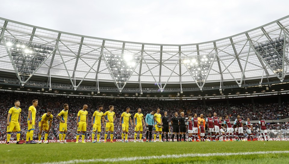  The teams line up for West Ham's first match at their Stratford home