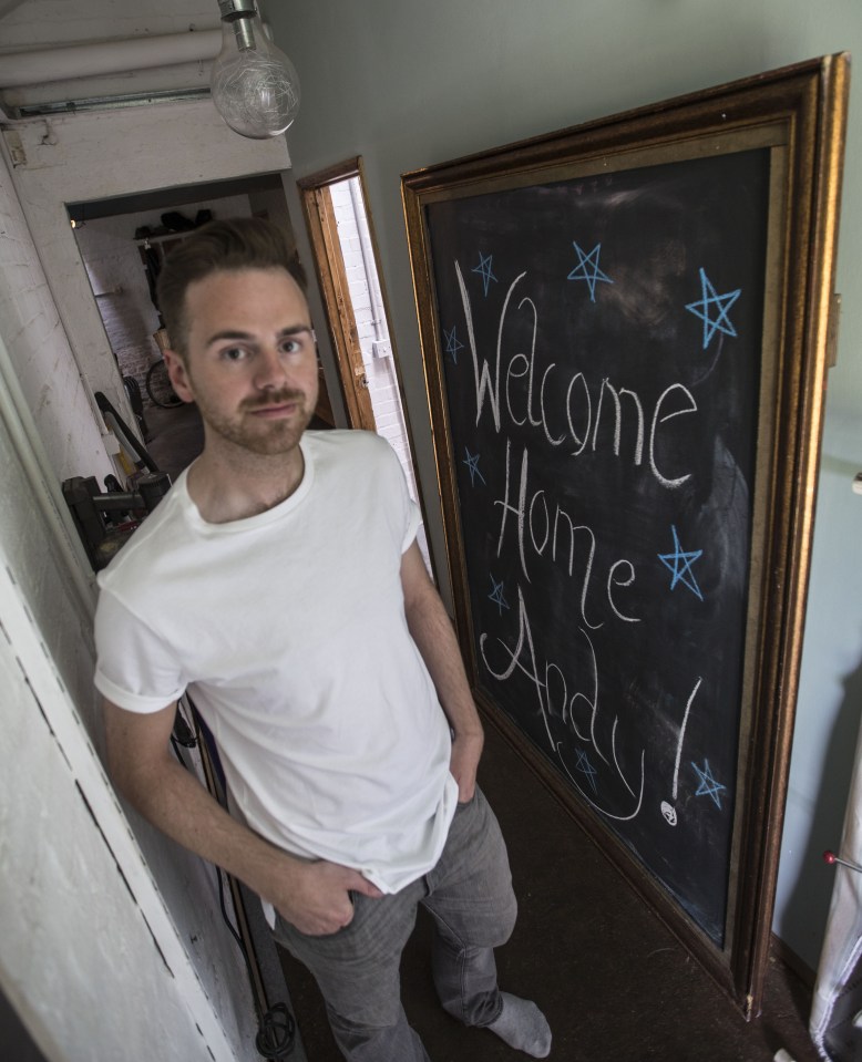 Standing by a 'Welcome Home' sign that was left for him by Ed - who he has now thrown out of their home