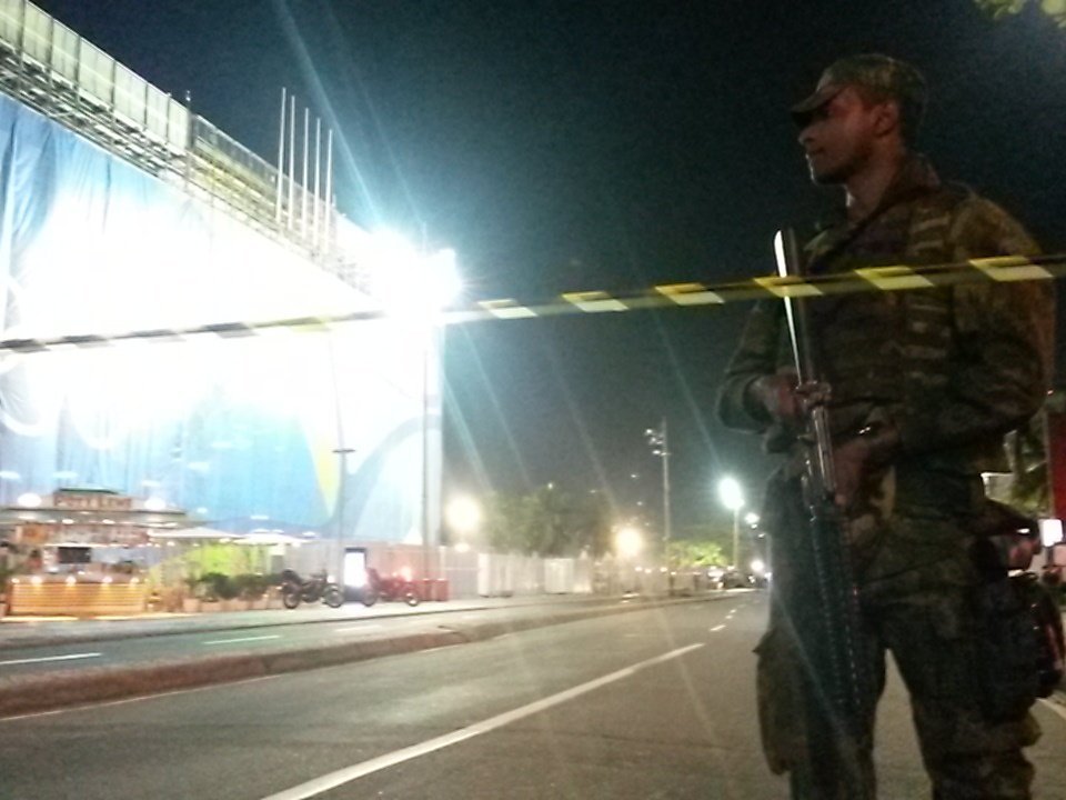  Police marshal protesters outside the stadium