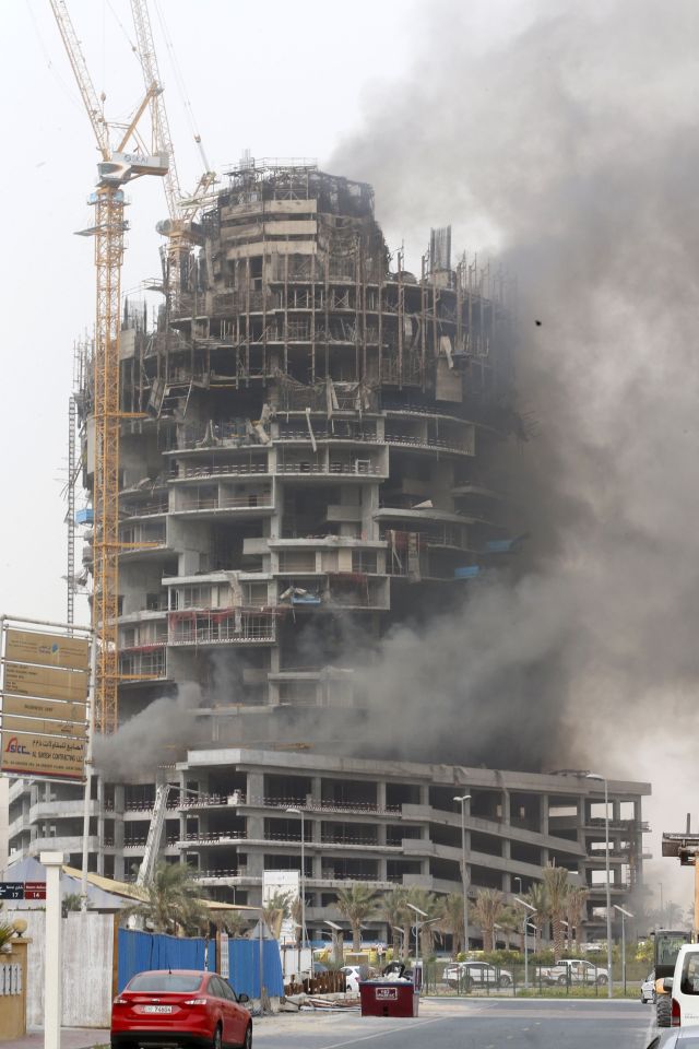  Smoke billows from an under-construction building near Dubai's Jumeirah Village Circle