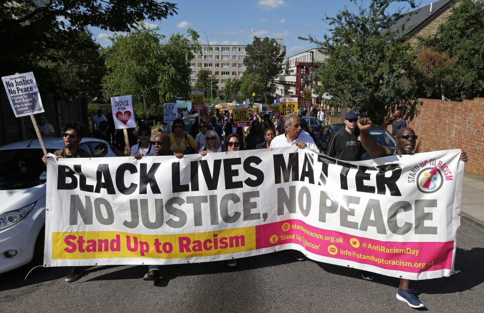  The group held aloft a large banner which read "Black Lives Matter, no justice no peace"