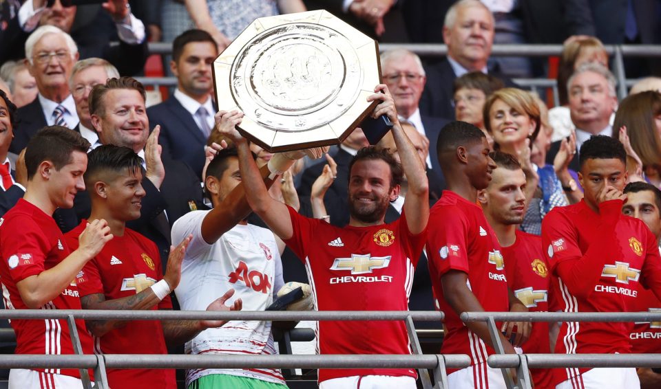  Mata seemed in good spirits as he happily lifted the Community Shield