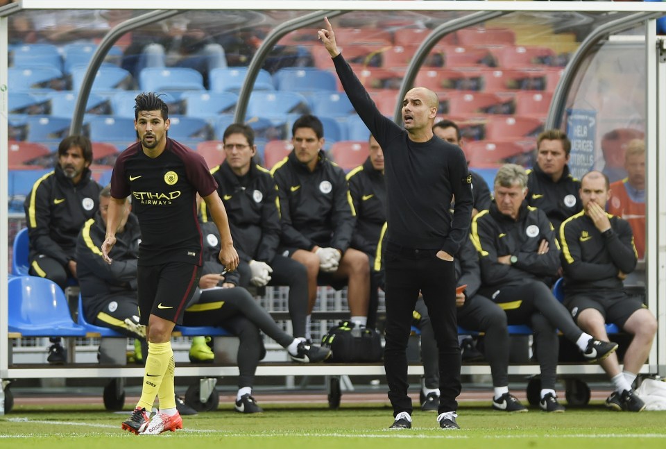  Pep Guardiola barks instructions from the sideline