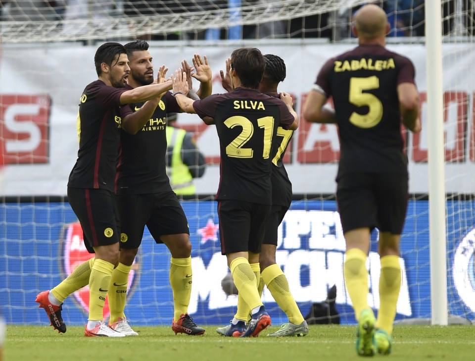  Sergio Aguero celebrates scoring the opening goal