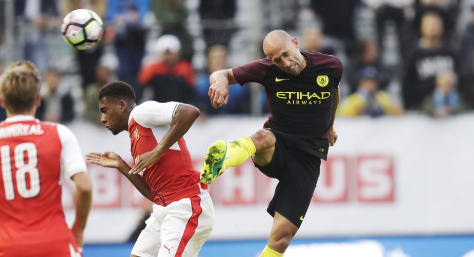  Manchester City defender Pablo Zabaleta gets to grips with Arsenal's Alex Iwobi during the pre-season friendly this summer in Ullevi