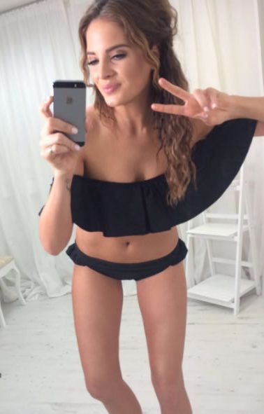  Binky flaunts her bikini bod in a black two-piece