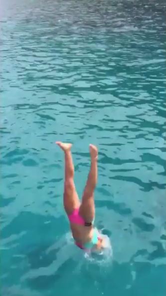  Star shows she's still got it as she takes a dip