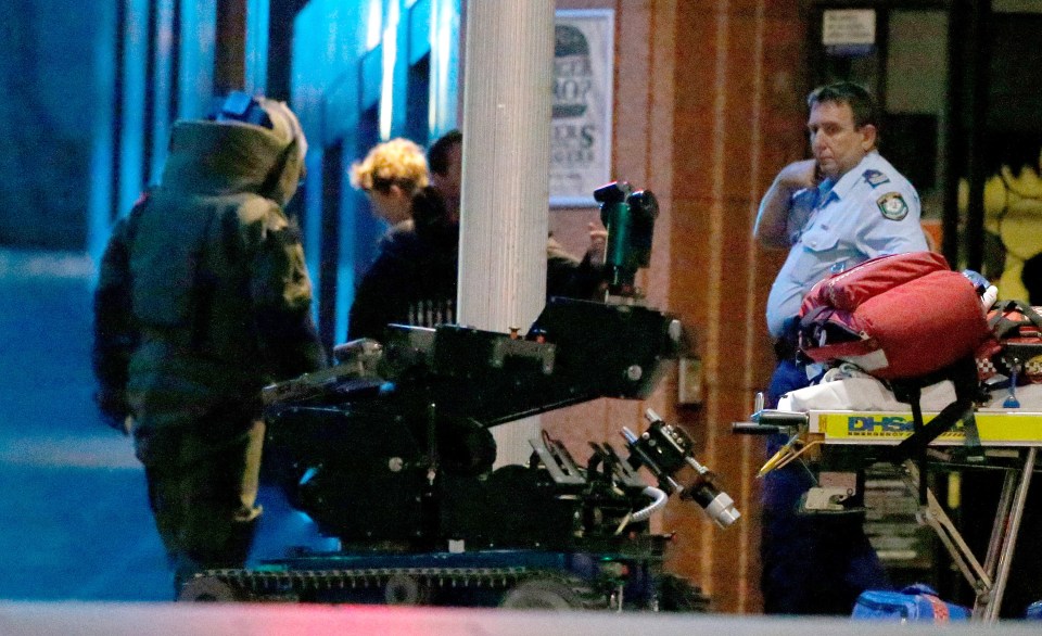  An anti-explosives robot sits at the cafe following the standoff