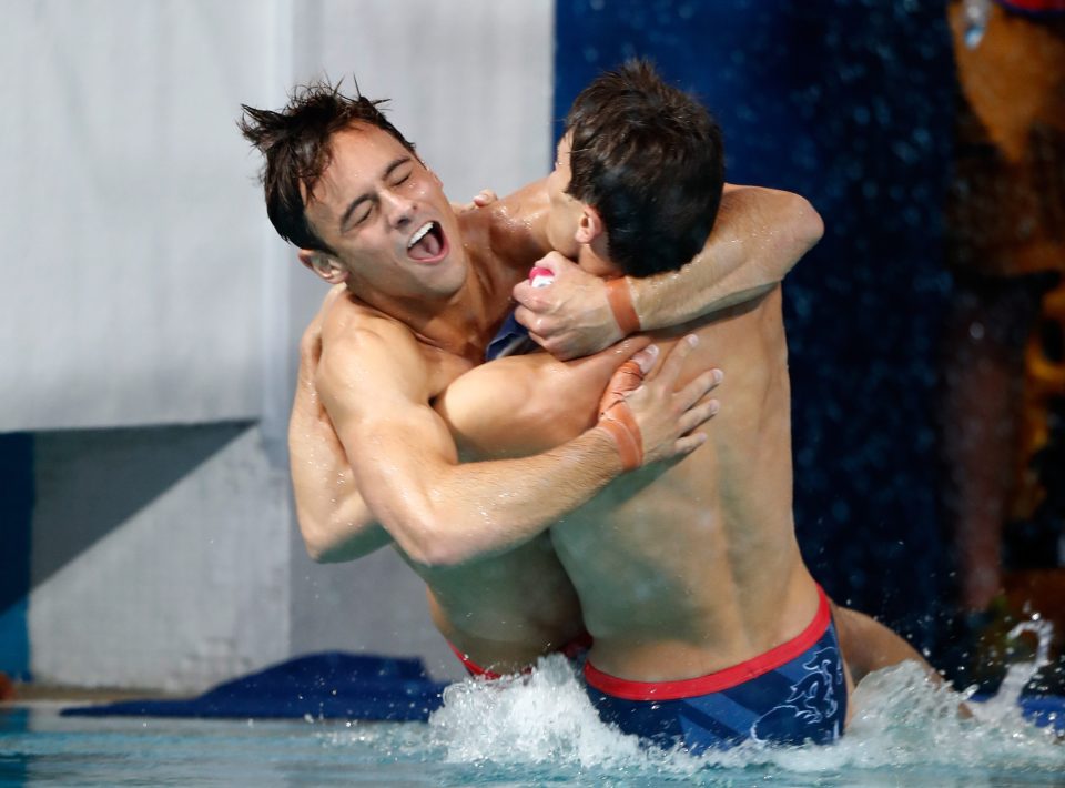 Tom Daley and Daniel Goodfellow of Great Britain celebrate winning bronze in the men's diving 10m synchro