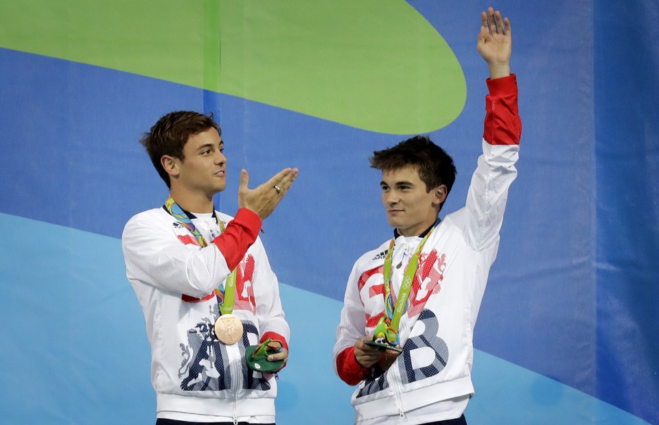 Daley blows a kiss as he and Goodfellow acknowledge their supporters