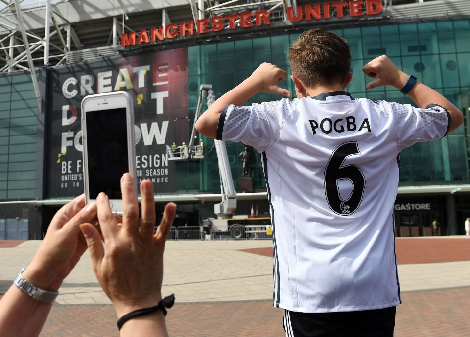  A United fan poses with a Pogba top on the brink of the new Prem Lge season