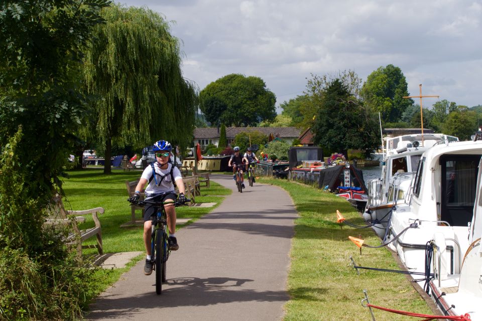  Teens enjoying cycling by the side of the Thames amid news that even better weather is due to arrive