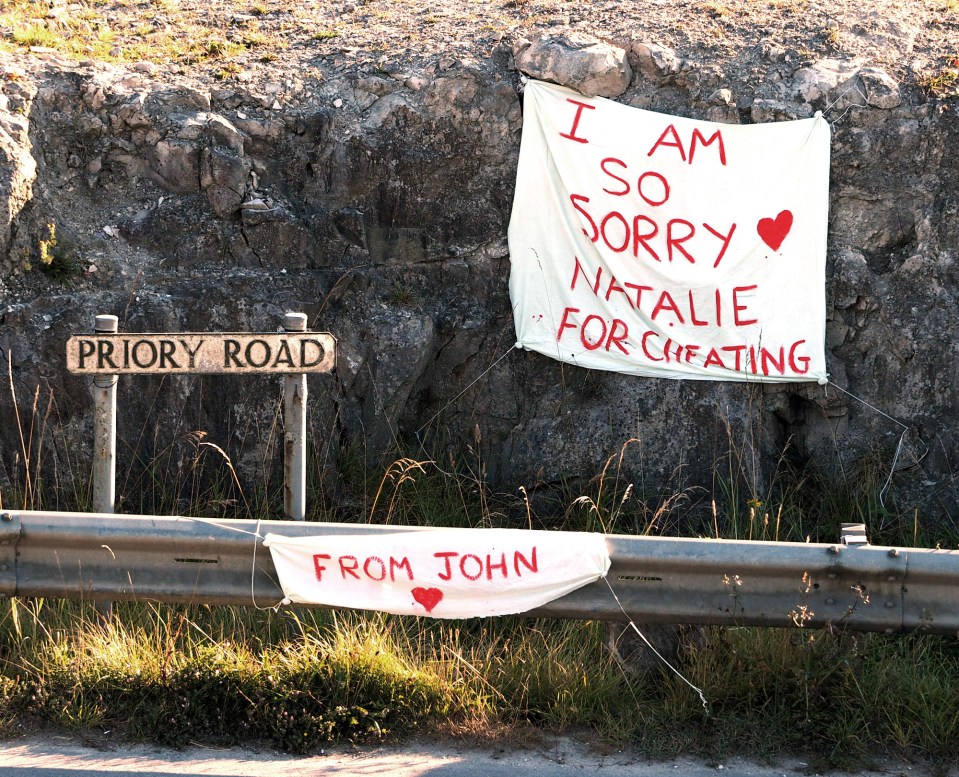  John left a highly visible message begging for Natalie's forgiveness on the side of the busy road