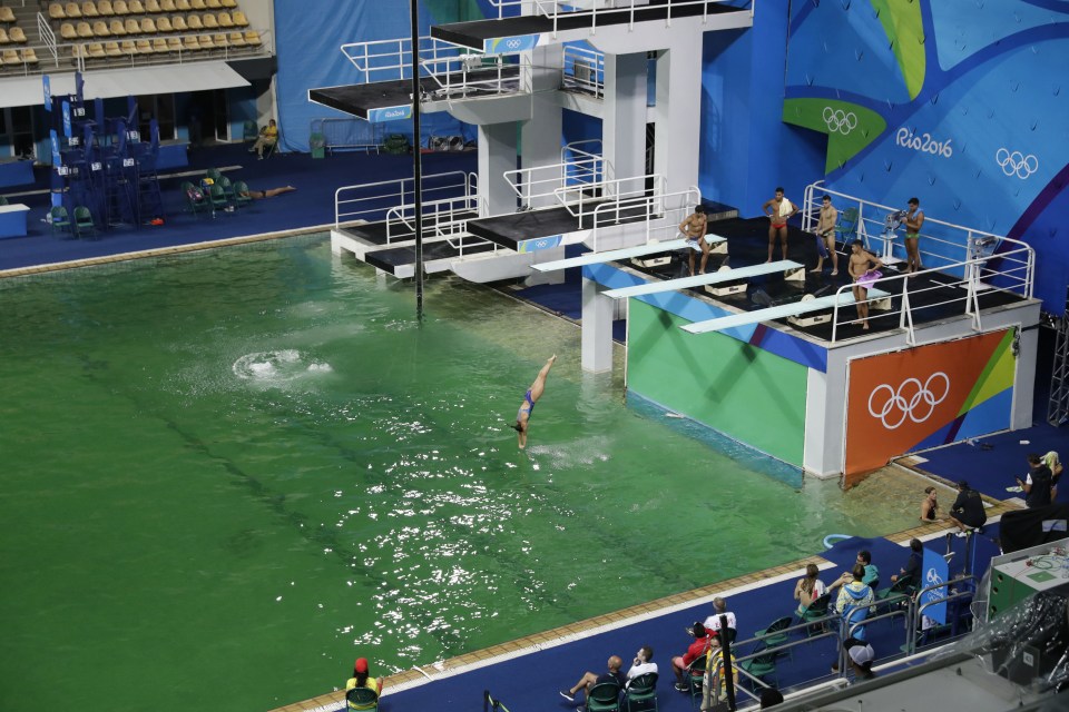  The water of the diving pool appears a murky green