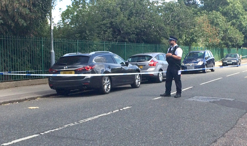  Police cordoned off Loxford Park in Ilford after an 11-year-old boy and a 22-year-old man were shot on Monday