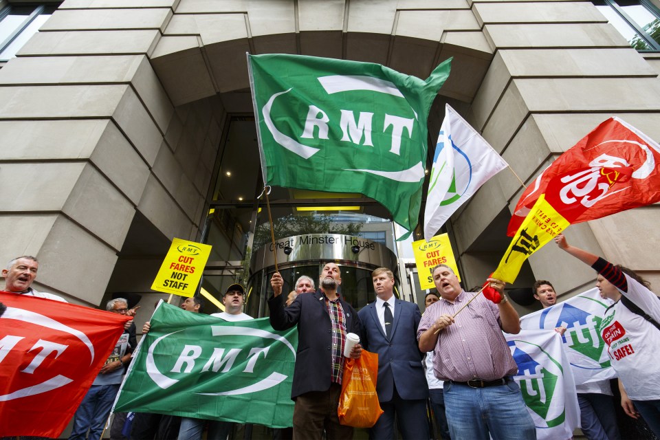 RMT union members staged a protest outside the Department of Transport in London yesterday to support the strike action on Southern Rail services 