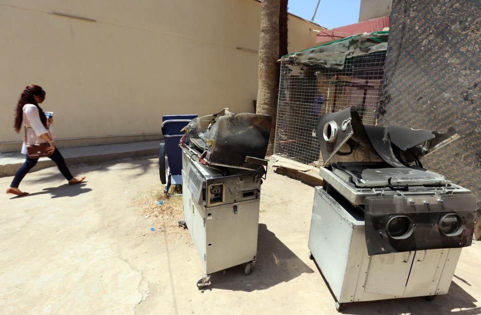  Charred baby incubators sit outside Yarmouk Hospital following the blaze