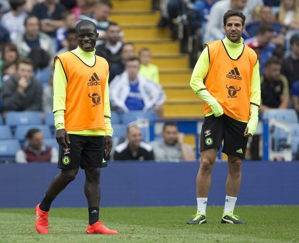  Cesc Fabregas and new midfield partner N'Golo Kante share a laugh in training