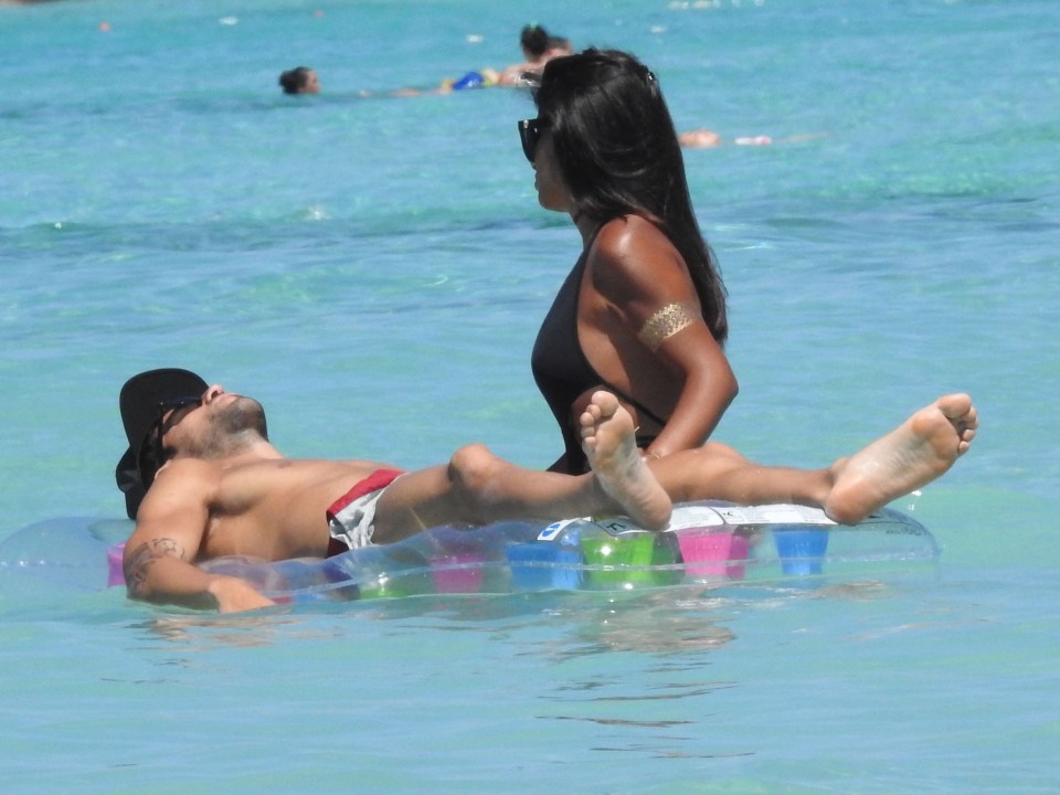  Cesc Fabregas and Wag Daniella Semaan relax in the sea on a last-minute holiday