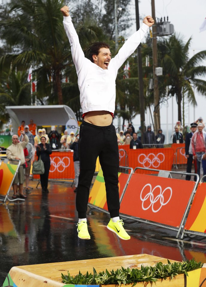  Cancellara celebrates on the podium after a storming race in the time trial