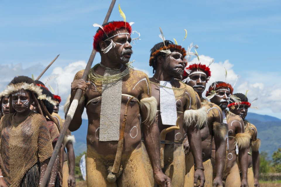  The men can be seen dressed in distinctive tribal attire