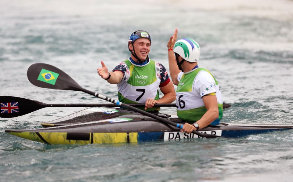  Joe Clarke gives Pedro Da Silva a high five after his speedy paddle down the slalom course