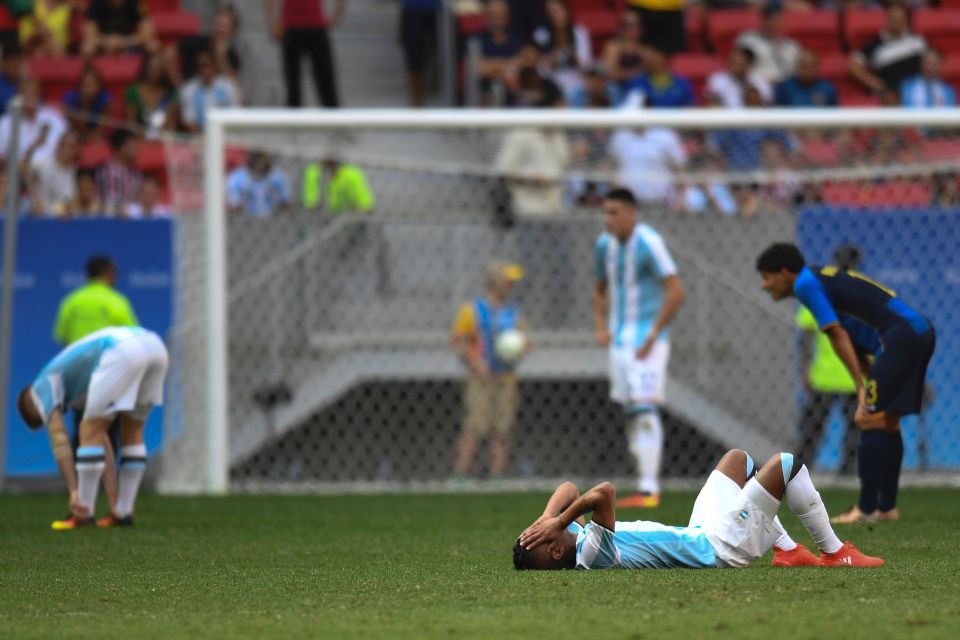  Argentina players look completely dejected after exiting the Rio Games