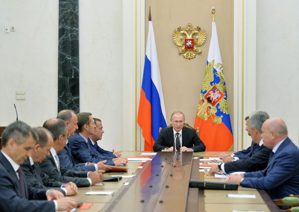  Russia's President Vladimir Putin attends a meeting with permanent members of the Security Council at the Kremlin on August 11