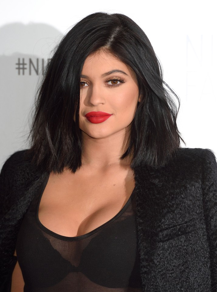  Kylie shows off the first results of her plumped up pout with a bright red lippie