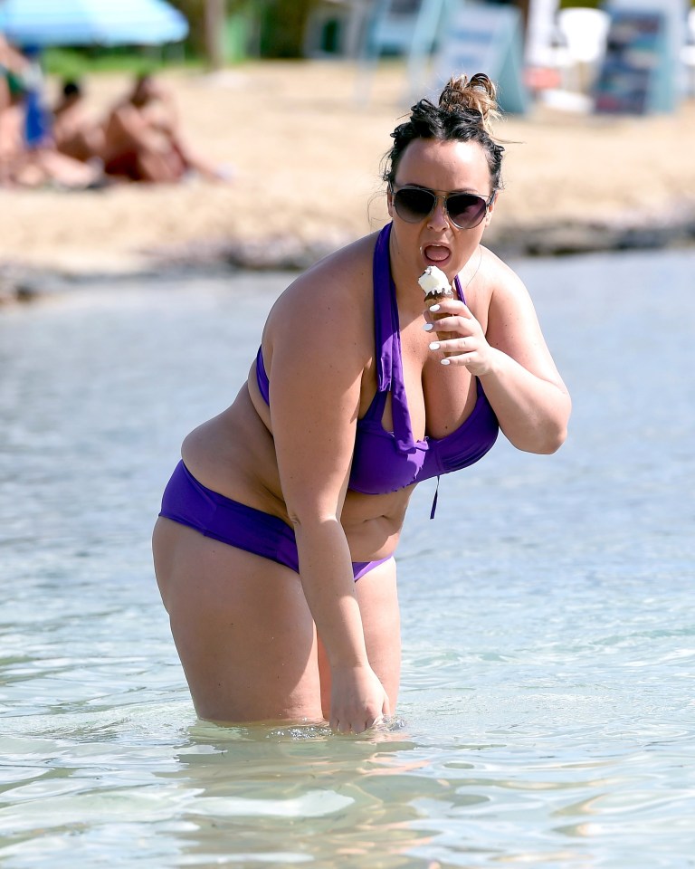  She stuck her hand in to the surf, as if to clean it of sticky ice-cream