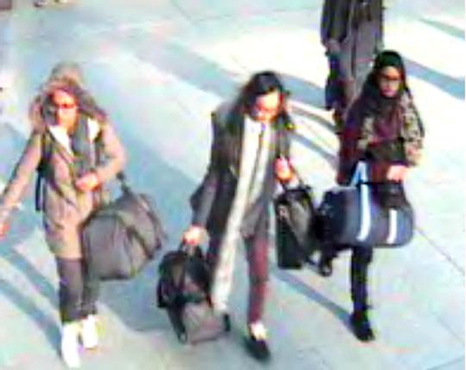  The young girl, middle, left with friends Amira Abase and Shamima Begum after telling their family they were going out for a day