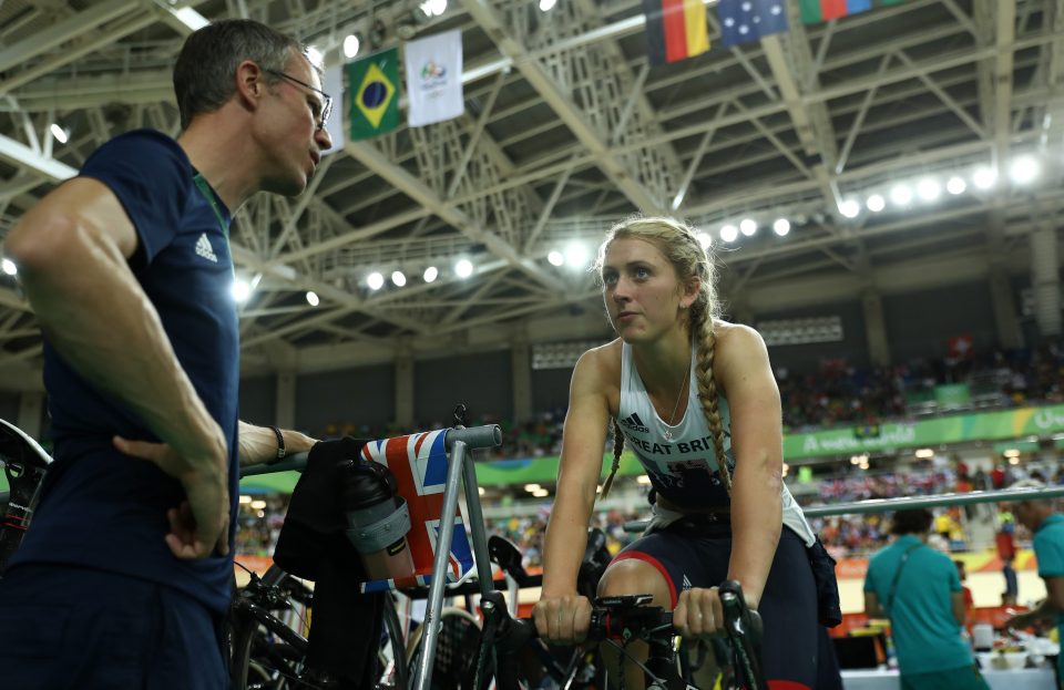  Laura consults her coach Paul Manning on day six of the Rio Games