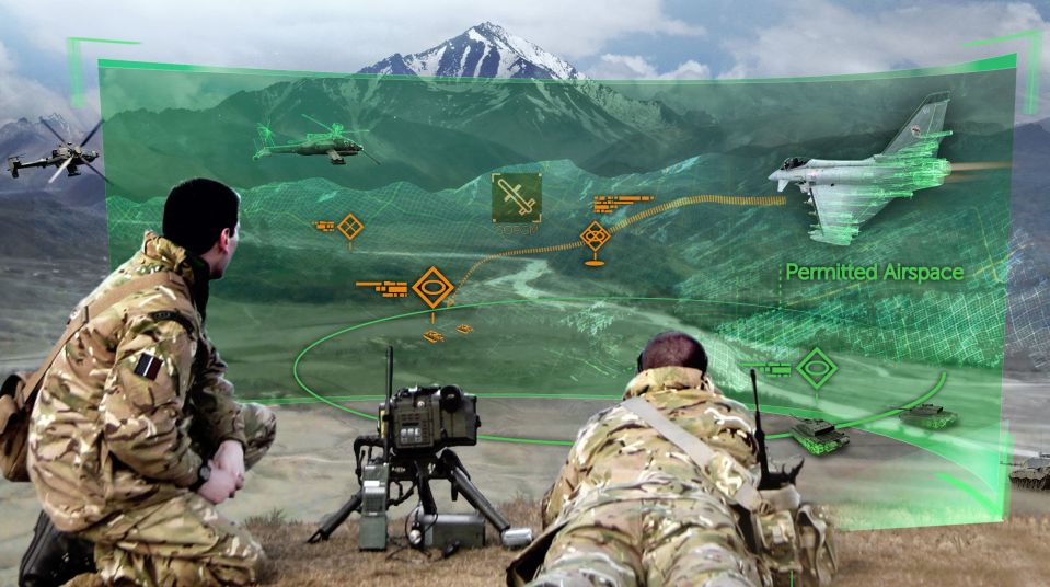  A graphic shows two soldiers using laser equipment which will be developed to bring down missiles and planes