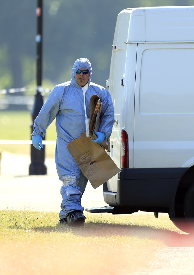  Forensic teams gather evidence in London's Hyde Park, close to Speakers' Corner, this morning