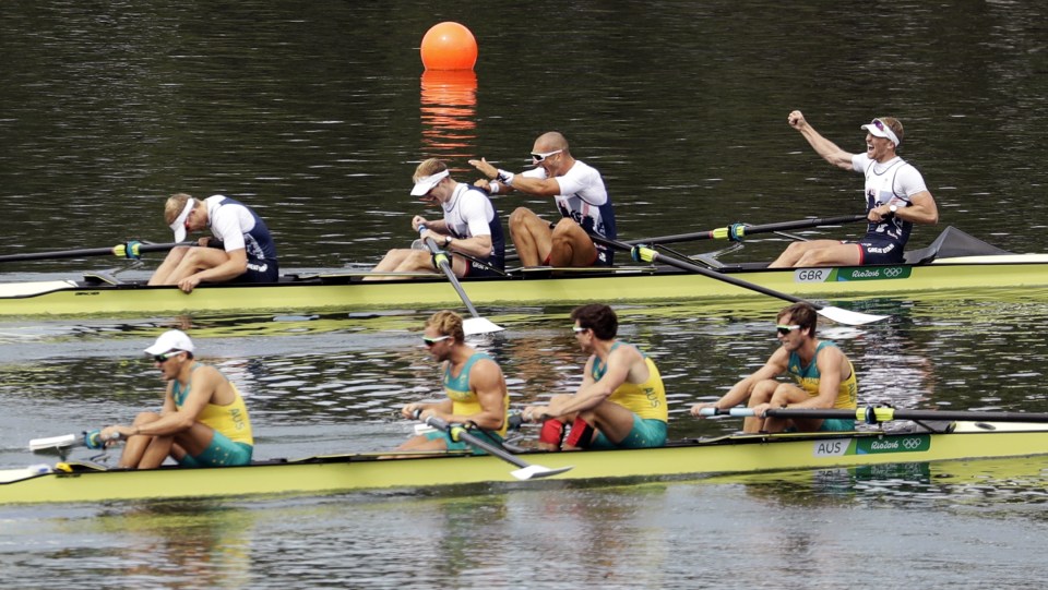  Team GB celebrate while Australia are left shattered at the end of the coxless fours